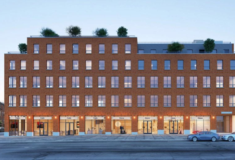 Exterior view of the brick facade and retail storefronts at 356 Wythe Avenue.