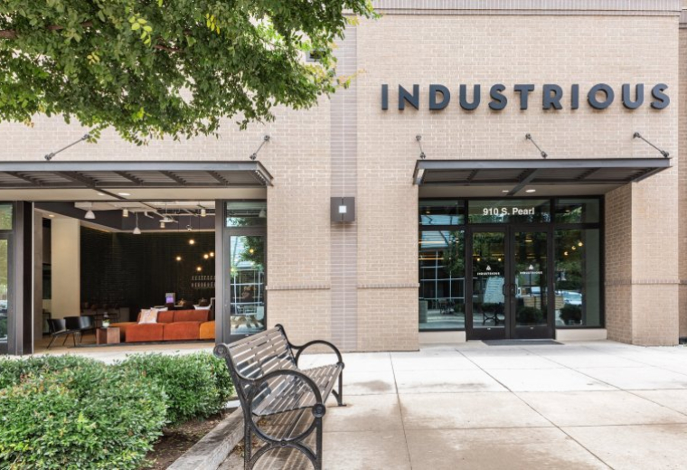 Exterior view of the Industrious building entrance at 910 S Pearl Expressway, Ground Floor.