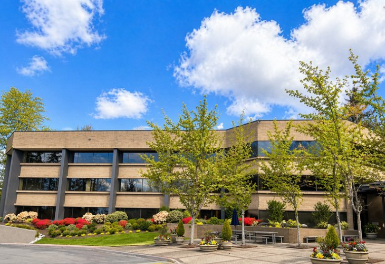 Exterior view of the landscaped office building at 11808, Northup Way, Suite 300 (BV3).