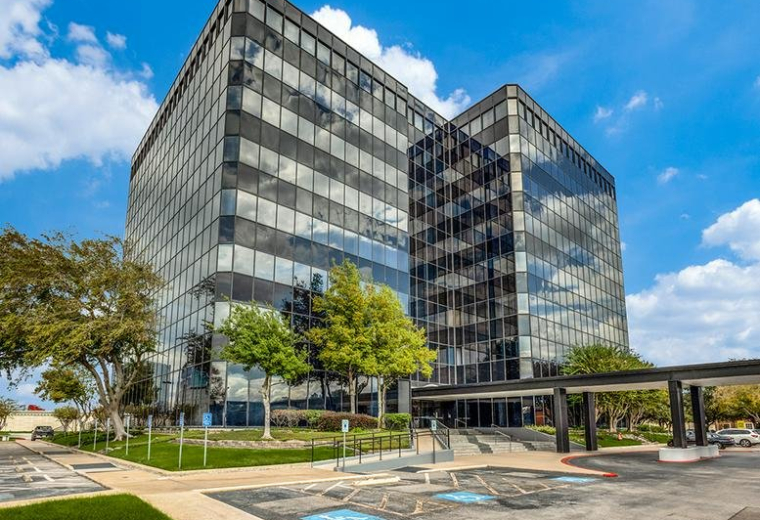 Exterior view of the glass and steel building facade at 13201 Northwest Freeway.