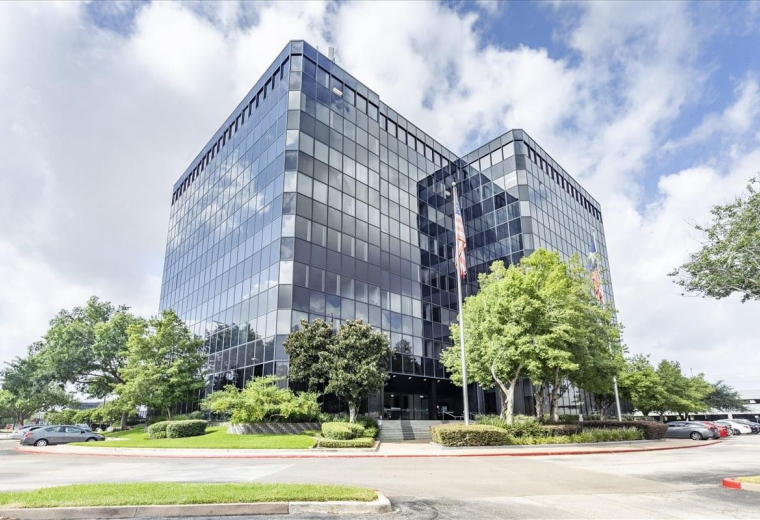 Exterior view of the glass-facade building at 13201 NW Freeway, Suite 800.