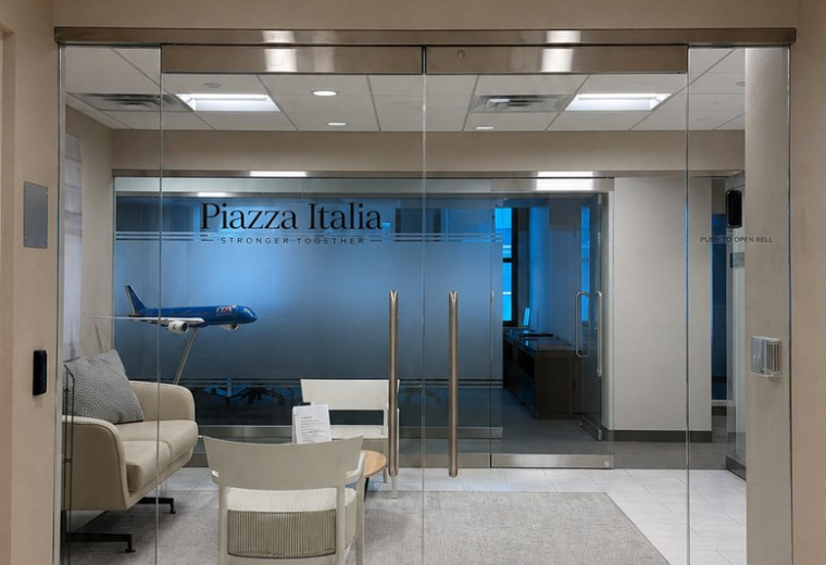 Glass-entrance to Piazza Italia reception.
