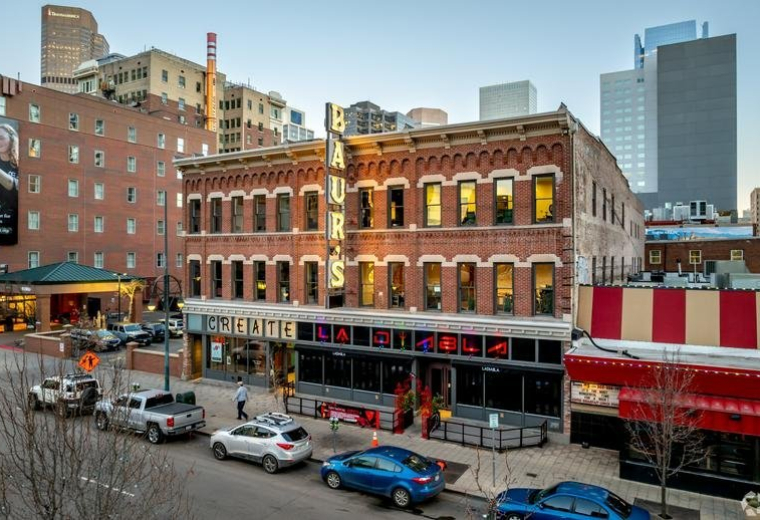 Exterior view of the historic red brick building at 1514, Curtis Street in downtown Denver.