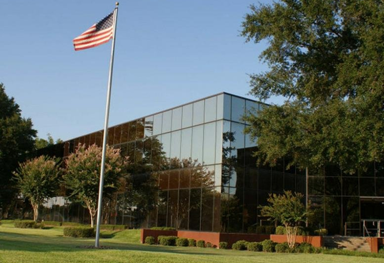 Exterior view of the mirrored glass office building at 16770 Imperial Valley Drive.