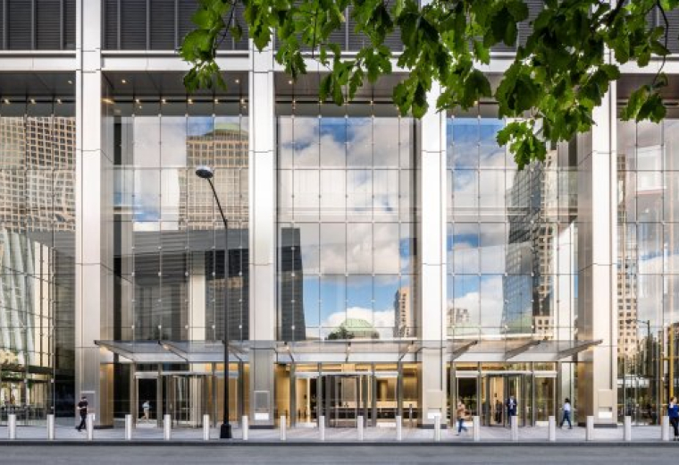 Exterior view of the grand glass-facade entrance at 175 Greenwich Street.