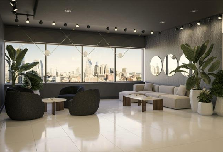 Light-filled lounge area with plush seating and panoramic city views.