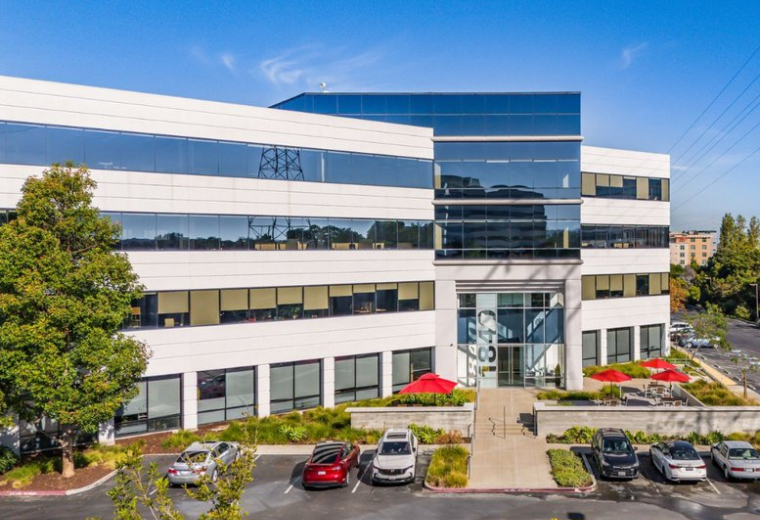 Exterior view of the contemporary glass-facade building at 1840, Gateway Drive, Suite 400.