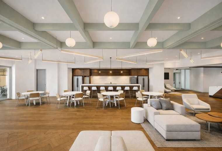 Spacious lounge at 18851, Northeast 29th Avenue, Suite 200 featuring a coffered ceiling and modern furniture.