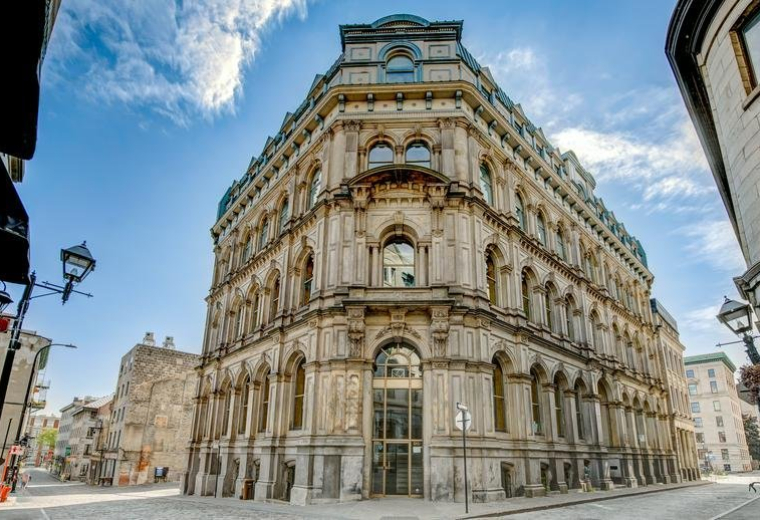 Exterior view of the historic stone facade at 204, Rue du Saint-Sacrement, #300.