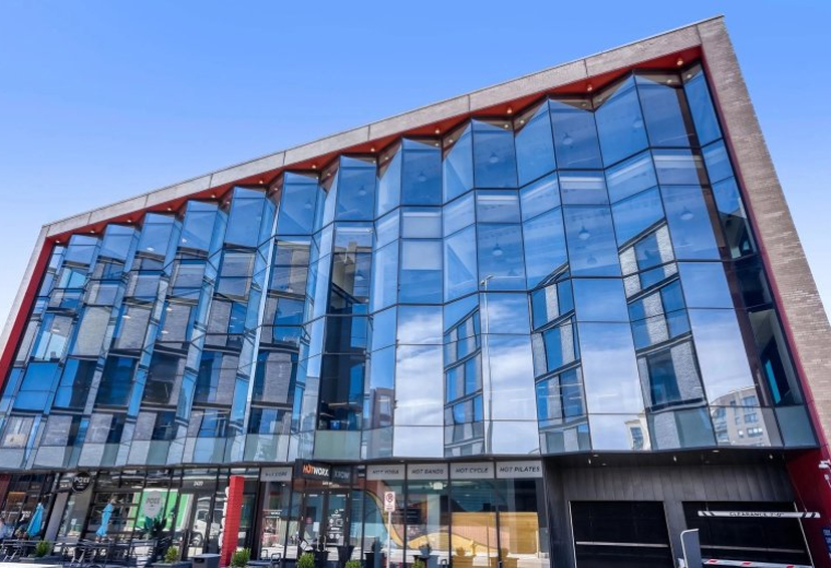 Exterior view of the glass-facade building at 2420 17th Street.