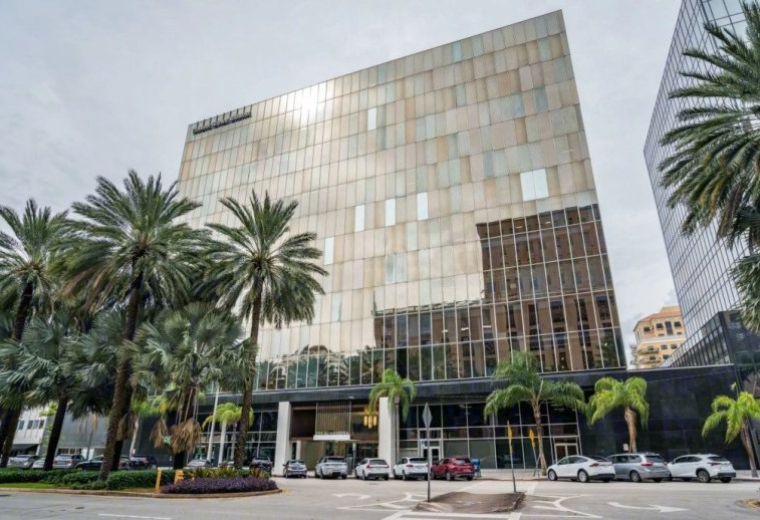 Exterior view of the multi-story glass facade building at 255 Alhambra Circle.