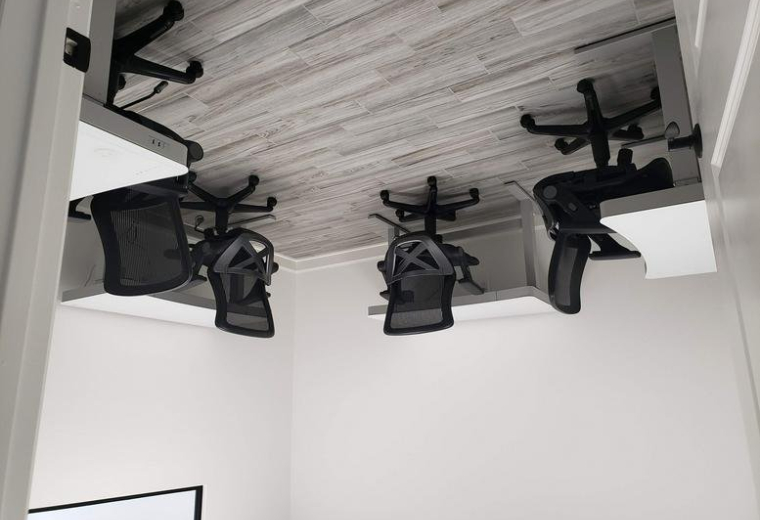 Spacious office suite at 26077, Nelson Way with four ergonomic workstations.