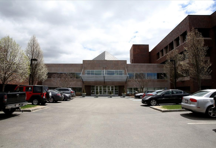 Exterior view of the brick facade and entrance at Dedham Place Business Centre.