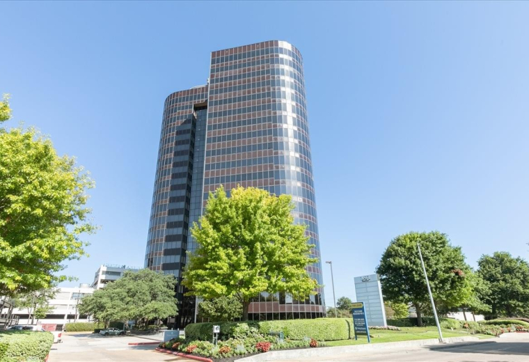 Exterior view of the multi-story glass office building at 363 N Sam Houston Pkwy E.