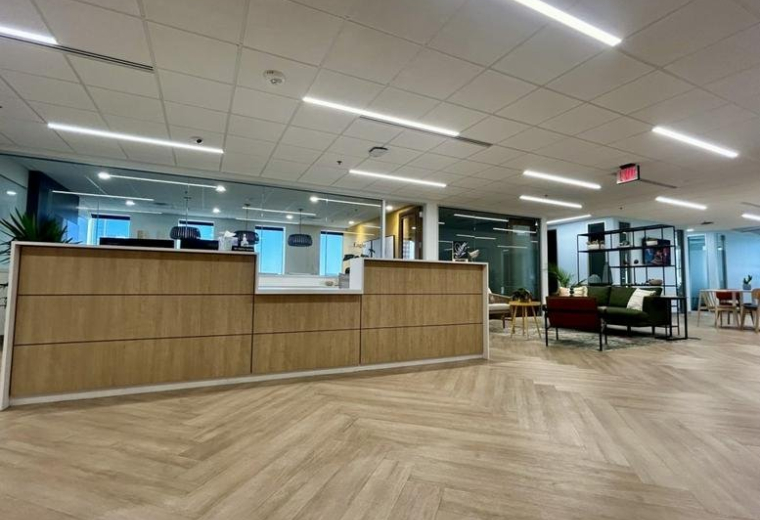 Welcoming wood-paneled reception desk at the 3838 North Central Avenue, Suite 900 entrance.