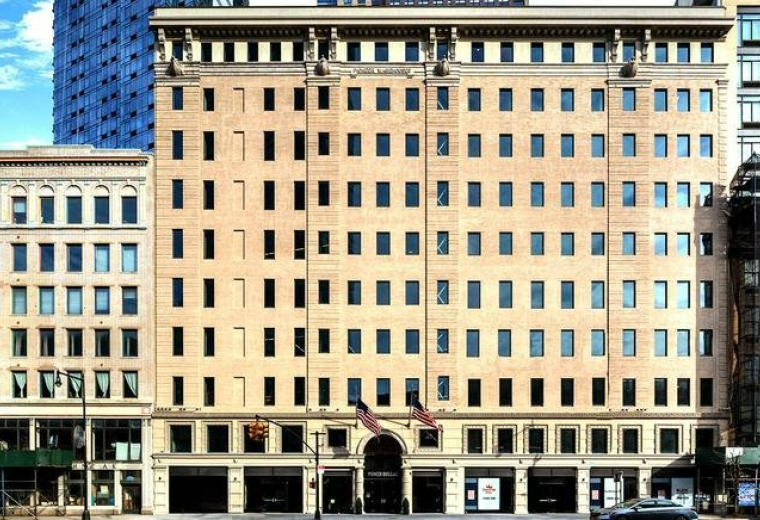Exterior view of the brick facade and arched entrance at 41 Flatbush Avenue.