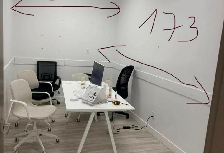 Private office room at 5021 Kingsway, Unit #114 featuring a white desk, chairs, and wall measurements.