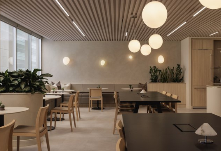 Spacious communal lounge and dining area with warm orb lighting at 550, 6 Avenue Southwest