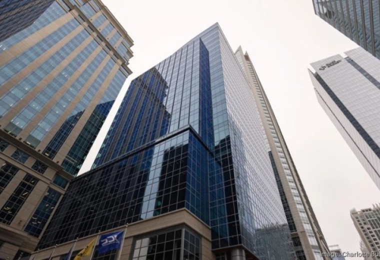 Exterior view of the glass-facade tower at 600 S Tryon Street in Charlotte.