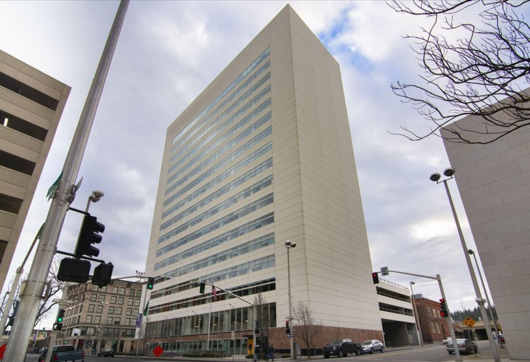 Exterior view of the towering white facade of The Wells Fargo Center.