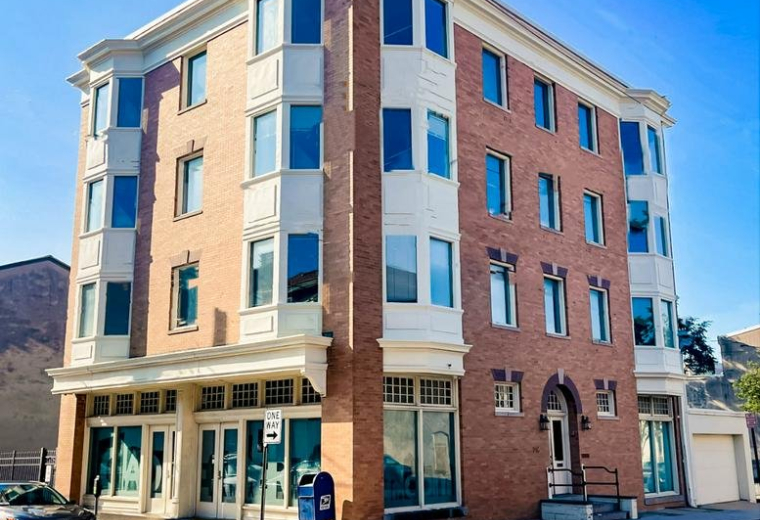 Exterior view of the brick building at 8th & Tatnall, 716 North Tatnall Street.