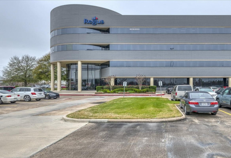 Modern curved exterior facade of the Willowbrook Business Center building.