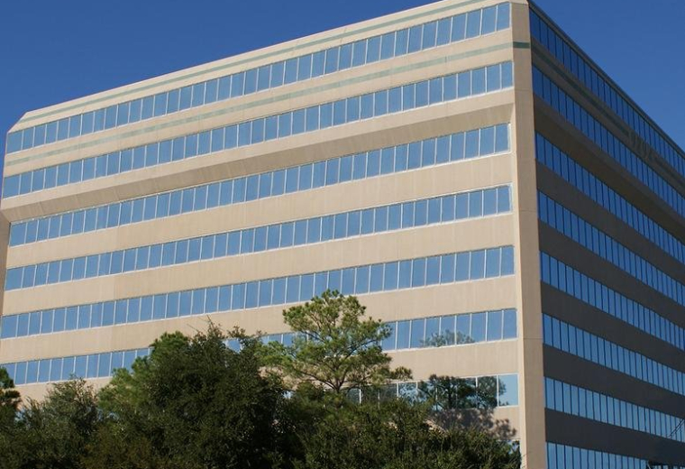 Exterior view of the multi-story professional office building at 9894 Bissonnet.
