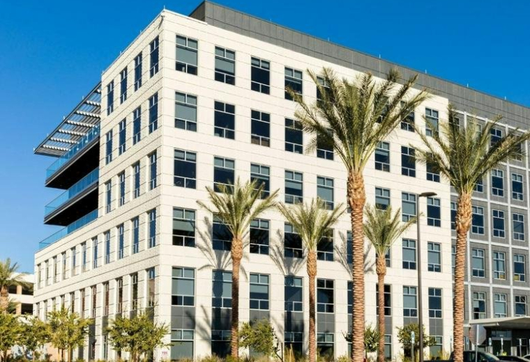 Exterior view of the modern white facade of Two Summerlin at 10845 Griffith Peak Drive.