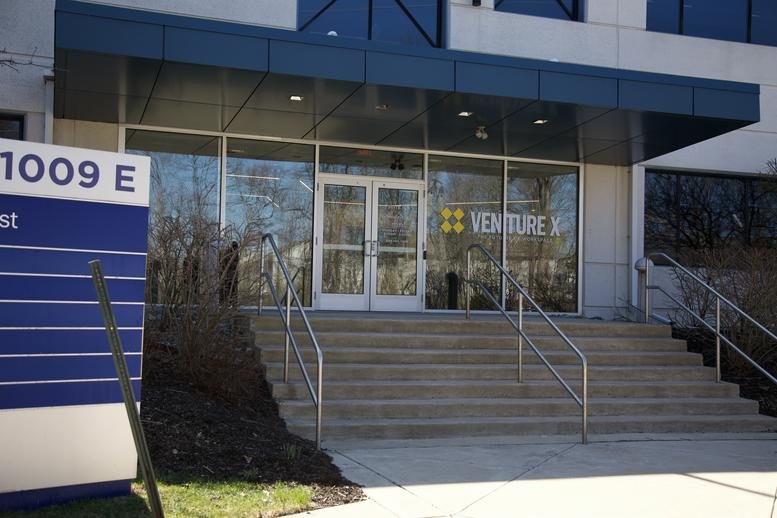 Exterior entrance with steps and a glass facade at 1009 Lenox Drive Suite 101.