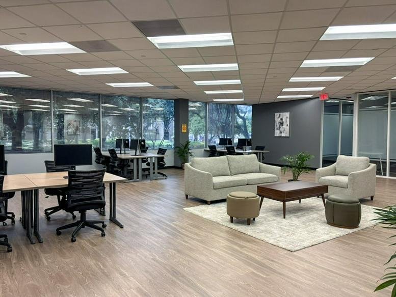 Spacious communal lounge and coworking area at 10850 Richmond Avenue Suite 110.