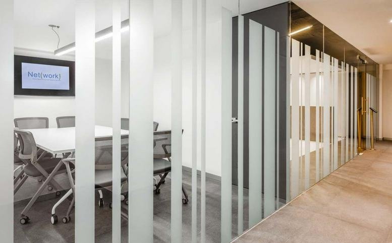 Modern conference room with glass walls and professional tech at 11, Avenida Jaime Balmes, Torre A piso 1.
