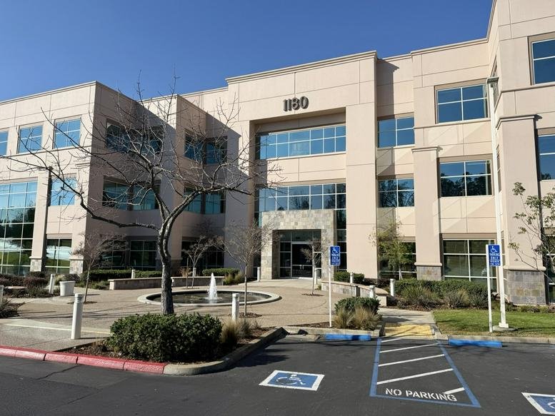 Exterior view of the multi-story professional building at 1180 Iron Point Rd.