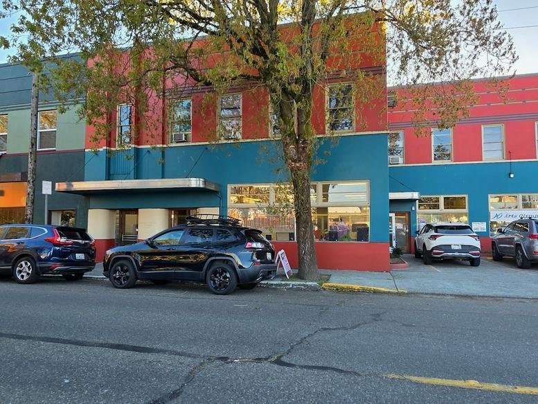 Exterior view of the colorful facade and entrance to 123, Washington Street Northeast.