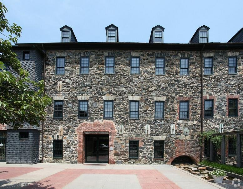 Exterior view of the historic stone-facade building at 1340 Smith Avenue Suite 200.