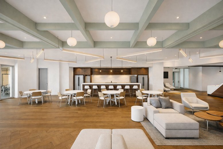 Spacious lounge at 18851, Northeast 29th Avenue, Suite 200 featuring a coffered ceiling and modern furniture.