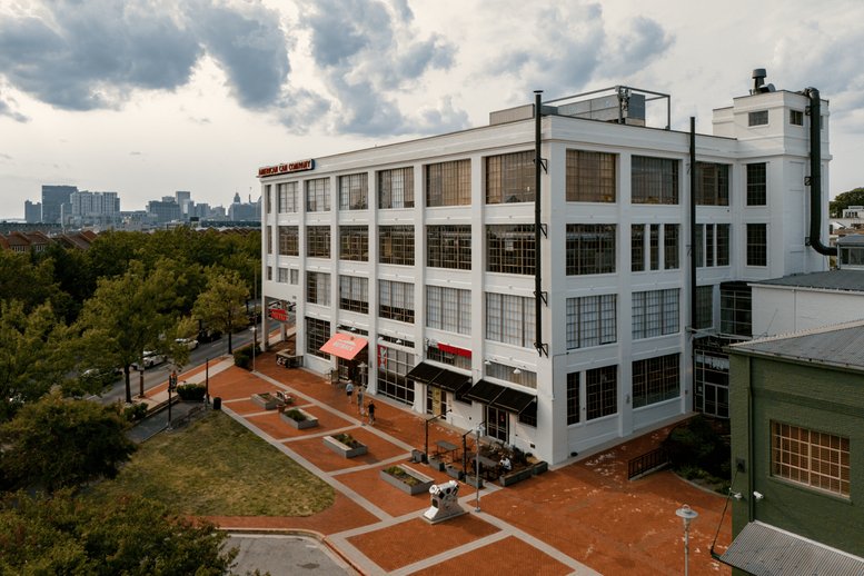 Exterior view of the white industrial-style Signature Building.