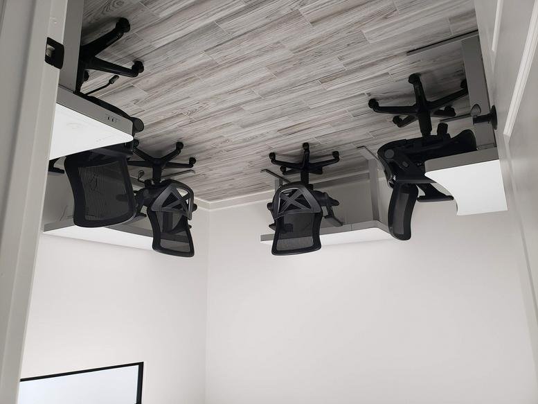 Spacious office suite at 26077, Nelson Way with four ergonomic workstations.
