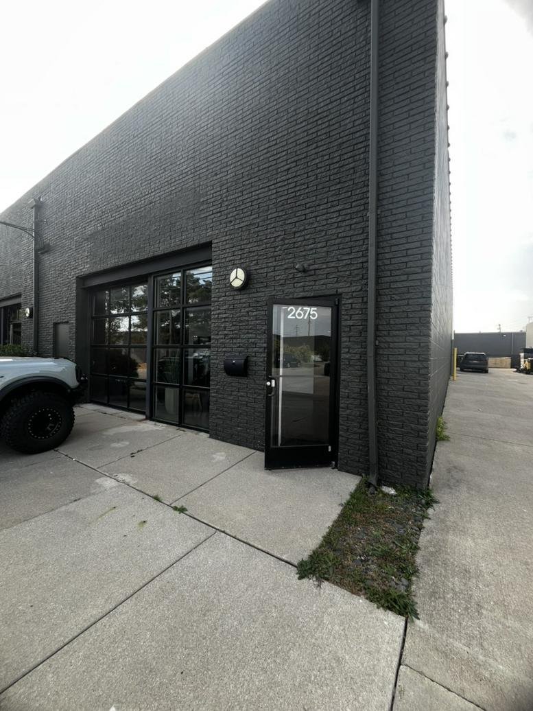 Modern black brick exterior and glass entrance of 2675 Nakota Road Suite C.