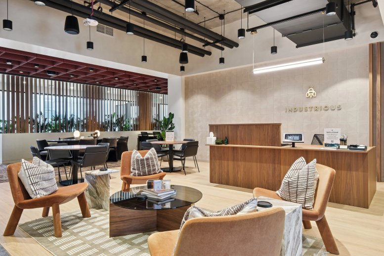 Spacious reception and lounge at 301 Howard Street, 3rd Floor, with warm wood tones and stylish seating.