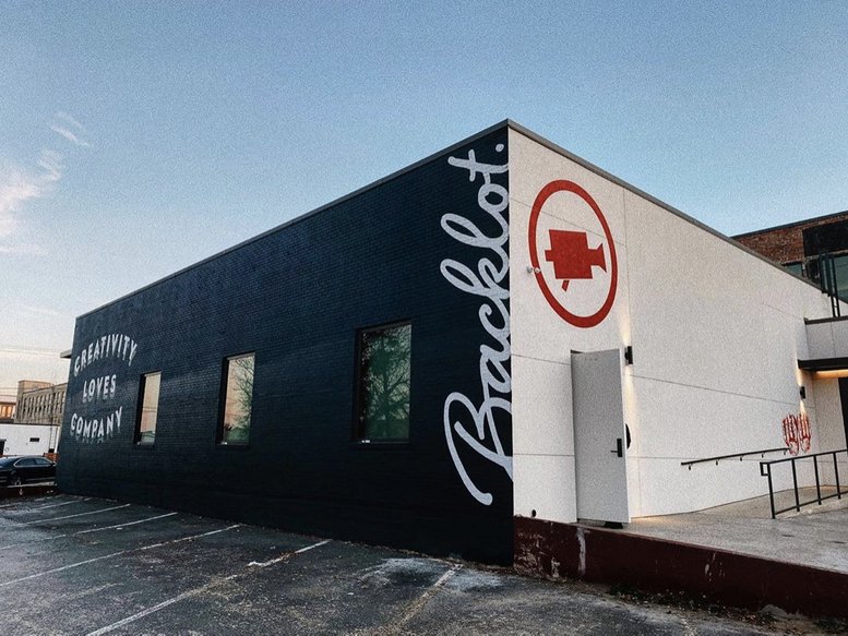 Exterior view of the black and white Backlot building at 329, South Main Street.