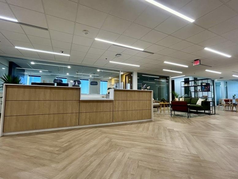 Welcoming wood-paneled reception desk at the 3838 North Central Avenue, Suite 900 entrance.