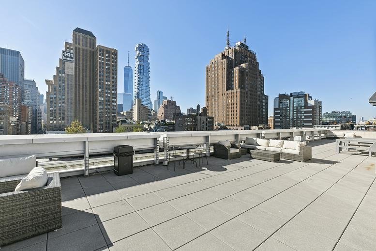 Expansive rooftop terrace at 433, Broadway with city views.