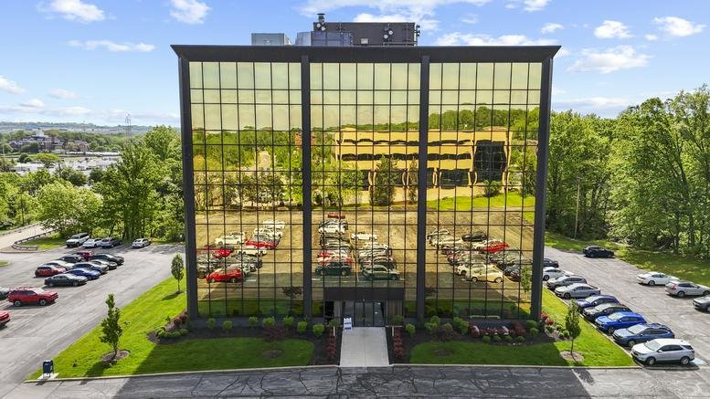 Exterior view of the glass-facade building at 4807 Rockside Road, Suite 400.
