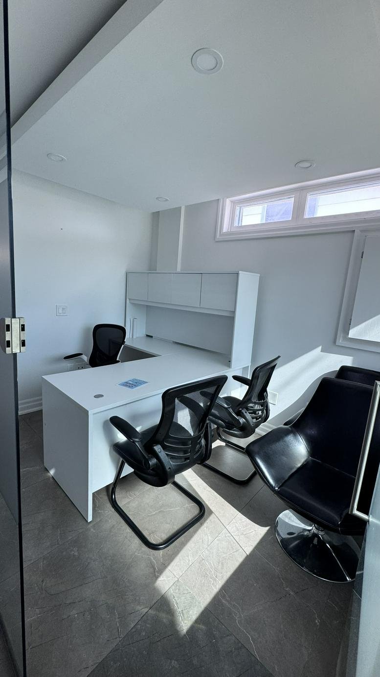 Front view of the office building with a concrete driveway.