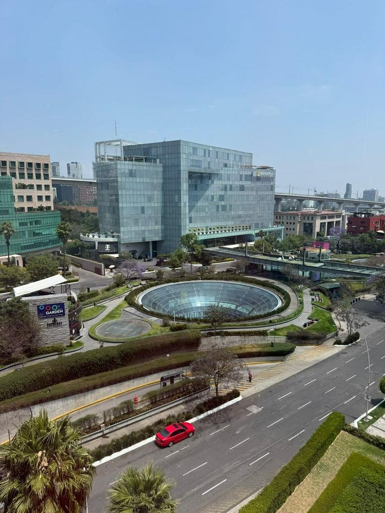 Aerial view of Calle Guillermo Gonzalez Camarena,PB building and surrounding urban landscape.
