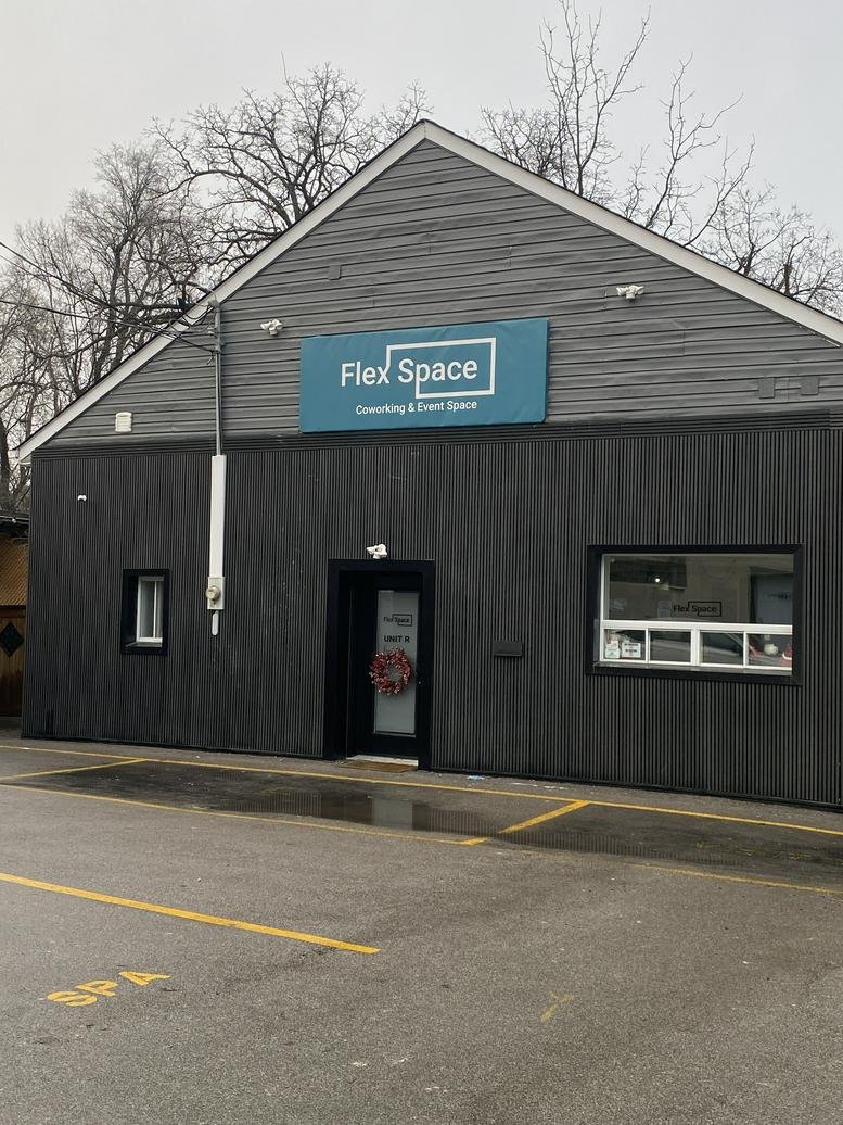 Entrance to Flex Space showing the modern grey exterior and signage.