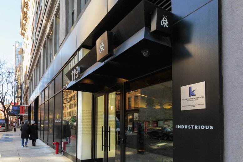 Exterior entrance of 119 West 24th Street, Floors 3-5 showing the black facade and Industrious signage.