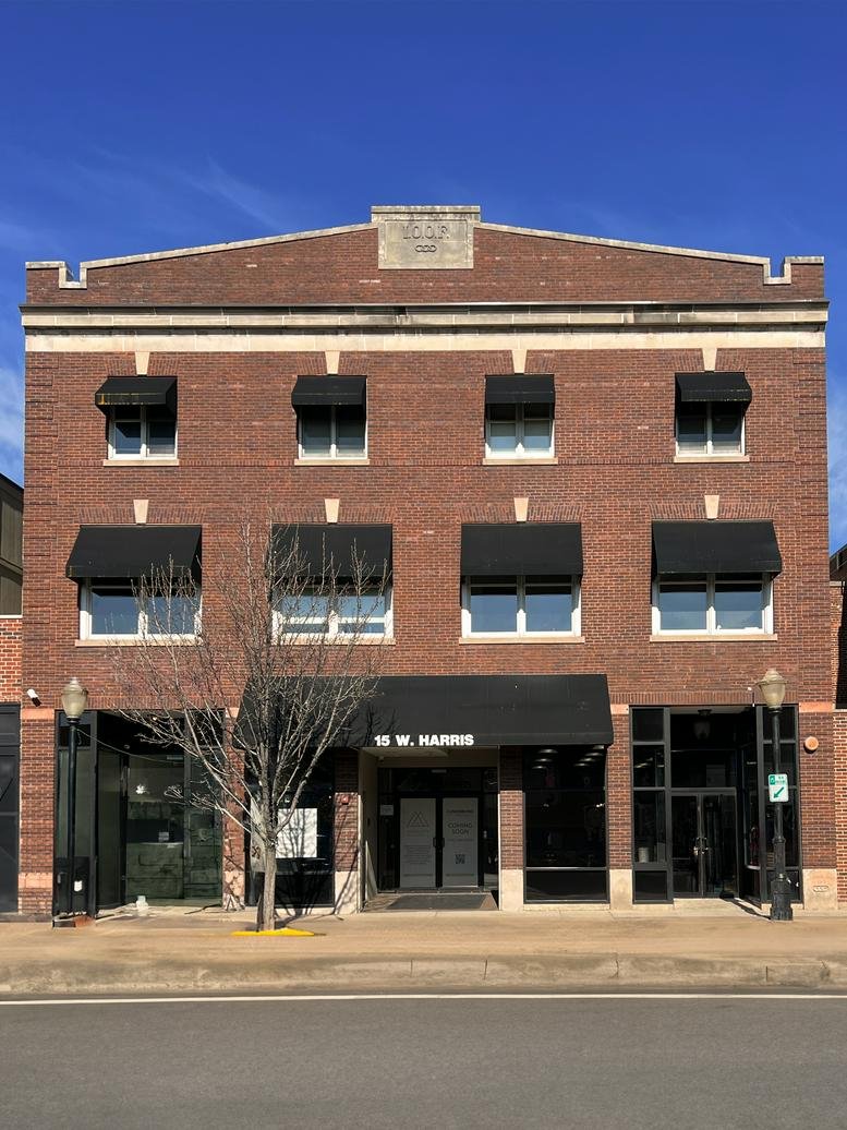 Exterior brick facade of the multi-story office building at 15 West Harris Avenue.