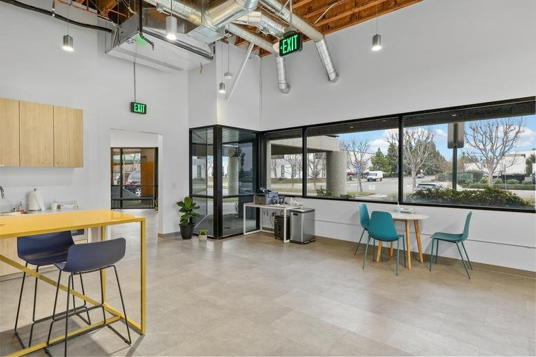 Spacious communal breakout area at 2335 West 208th Street, Torrance, California with yellow high-top table.