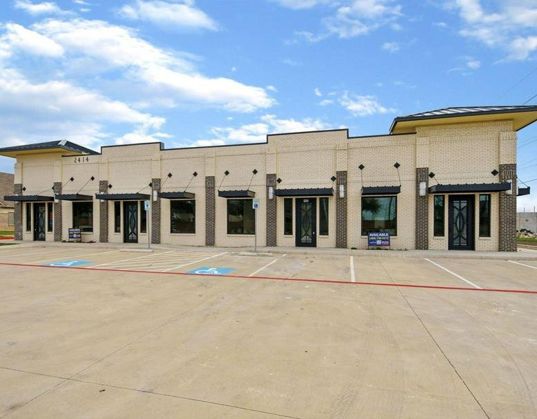 Exterior view of the multi-tenant commercial building at 2414 Marsh Lane.